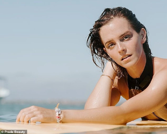 Emma Watson shows off her incredible figure in a black wetsuit