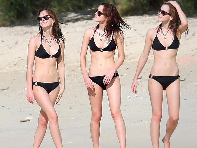 Emma Watson shows off her incredible figure in a black wetsuit