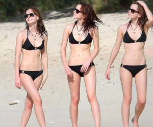 Emma Watson shows off her incredible figure in a black wetsuit